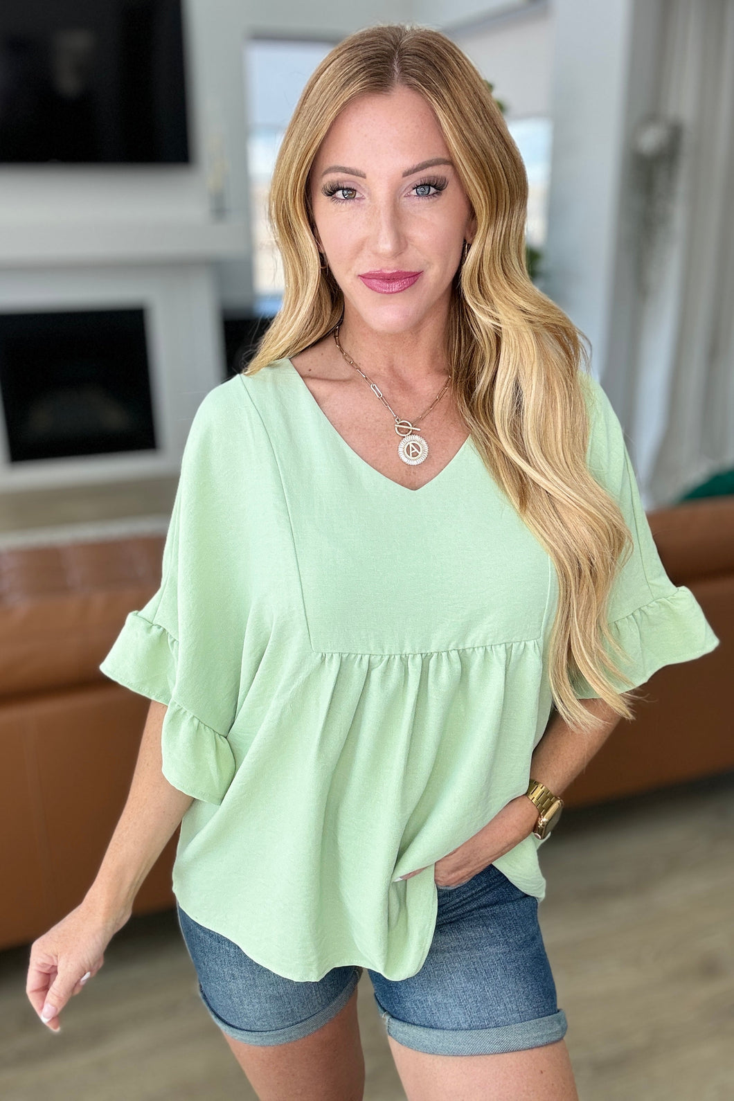 ANDREE BY UNIT- Airflow Peplum Ruffle Sleeve Top in Sage